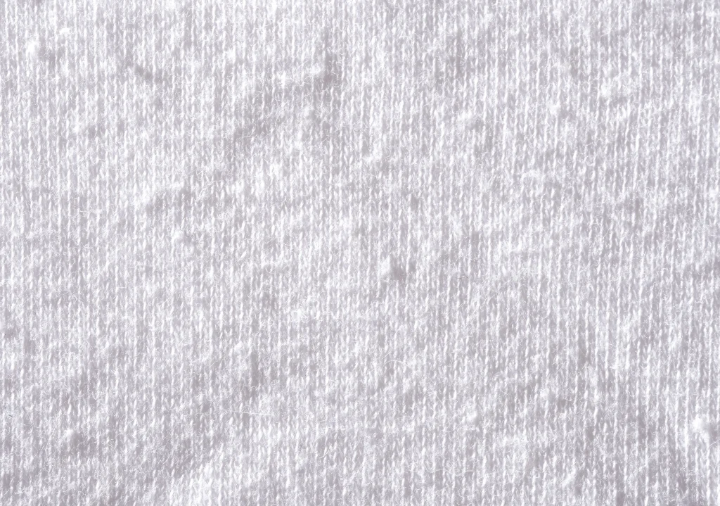 Close-up texture of 100% cotton single jersey fabric used for premium T-shirt manufacturing in Bangladesh.